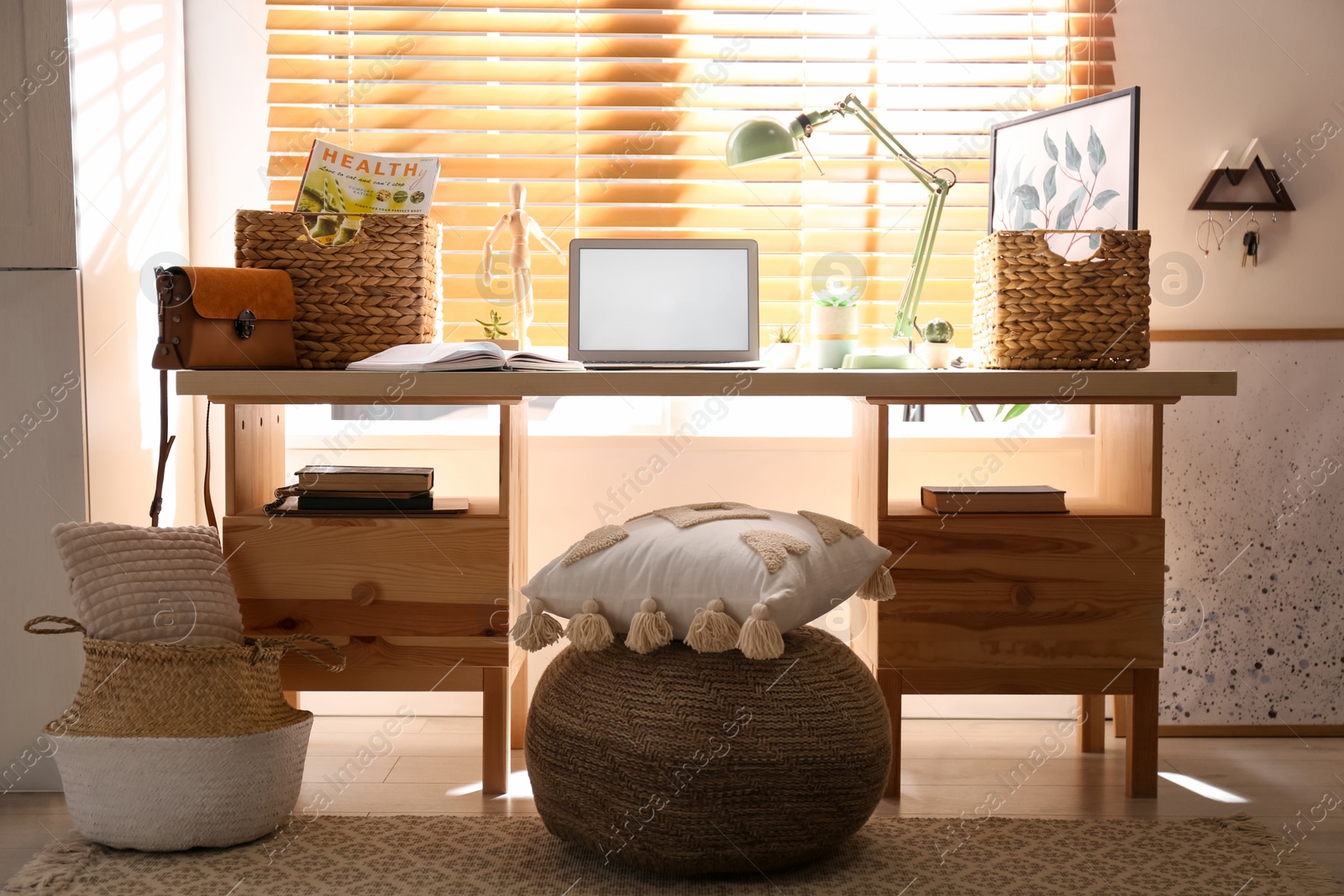 Photo of Comfortable workplace with laptop near window at home