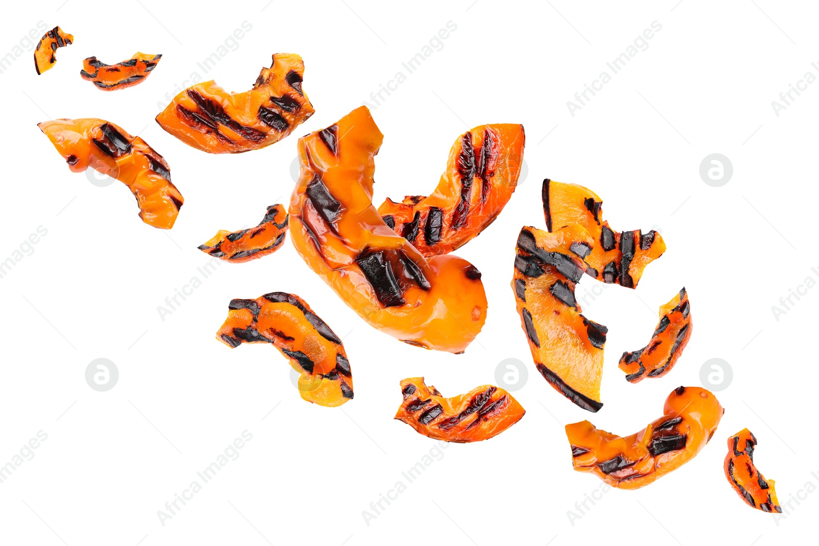 Image of Slices of grilled bell peppers in air on white background