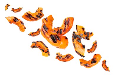 Image of Slices of grilled bell peppers in air on white background