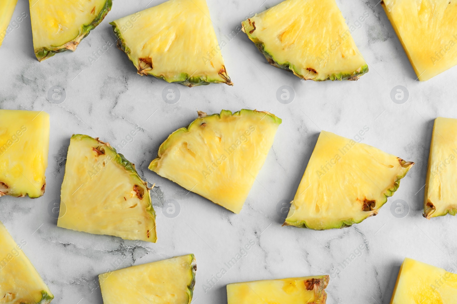 Photo of Flat lay composition with fresh sliced pineapple on marble background