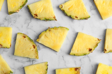 Photo of Flat lay composition with fresh sliced pineapple on marble background