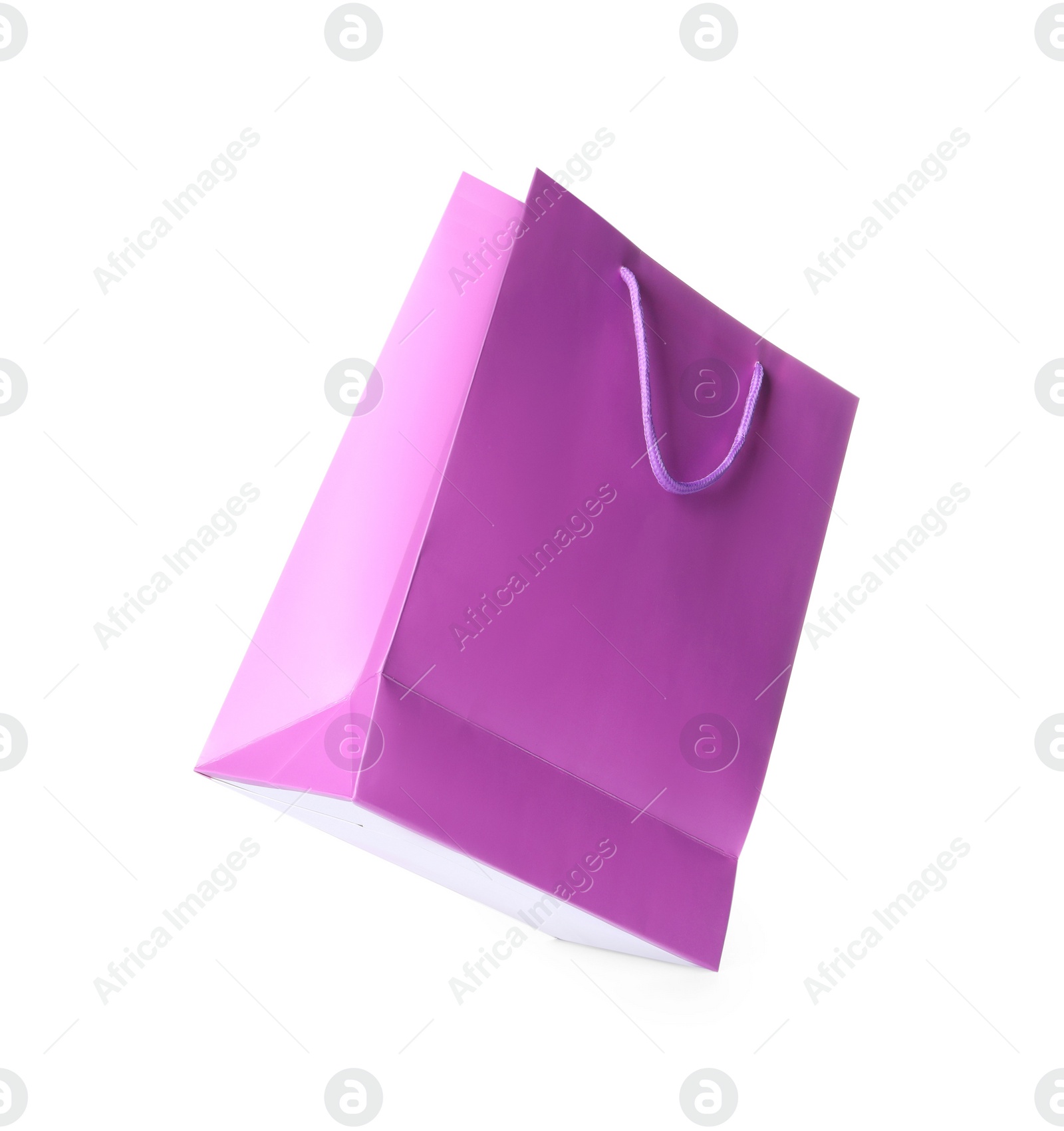 Photo of One violet shopping bag isolated on white