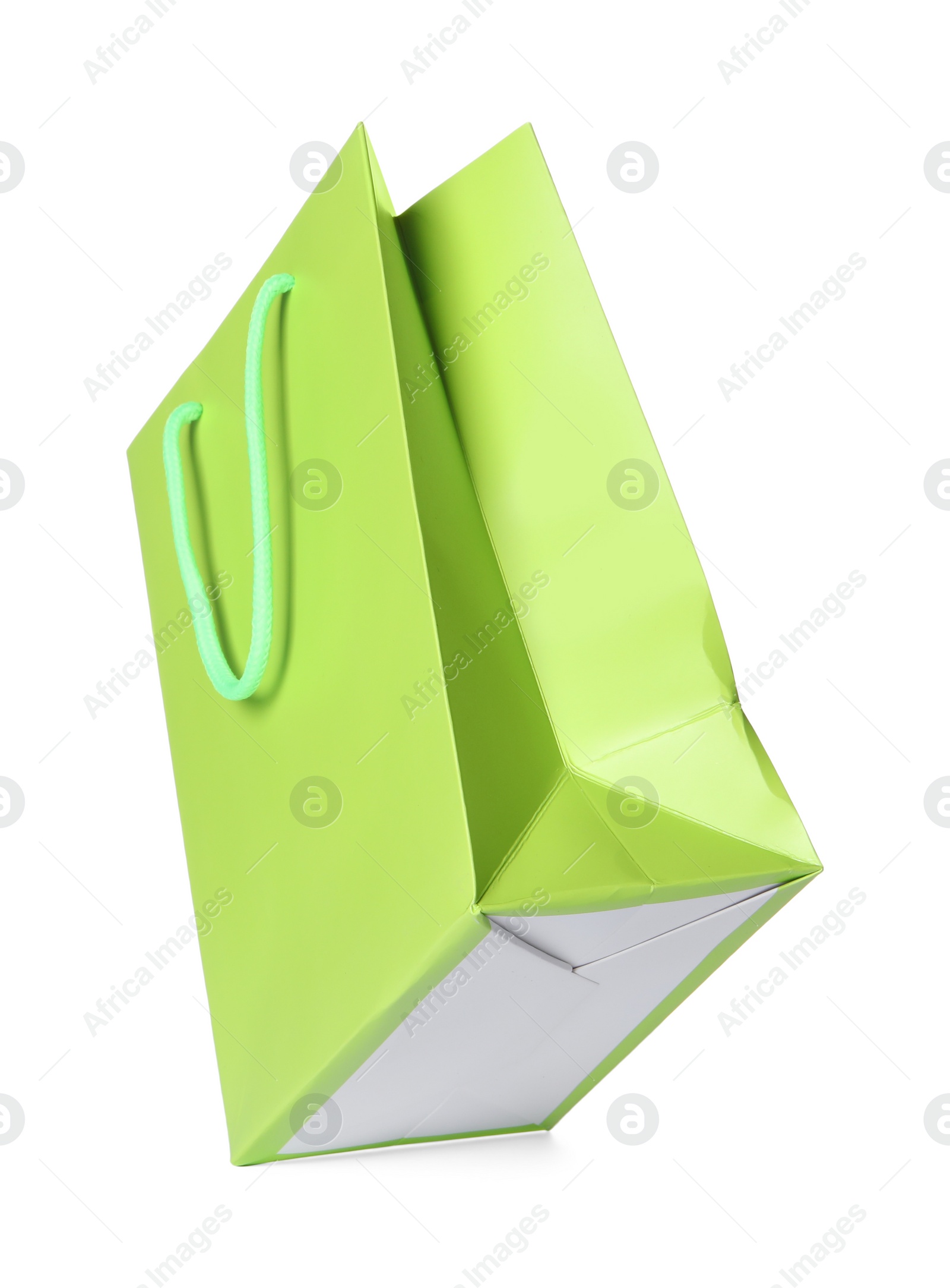 Photo of One green shopping bag isolated on white