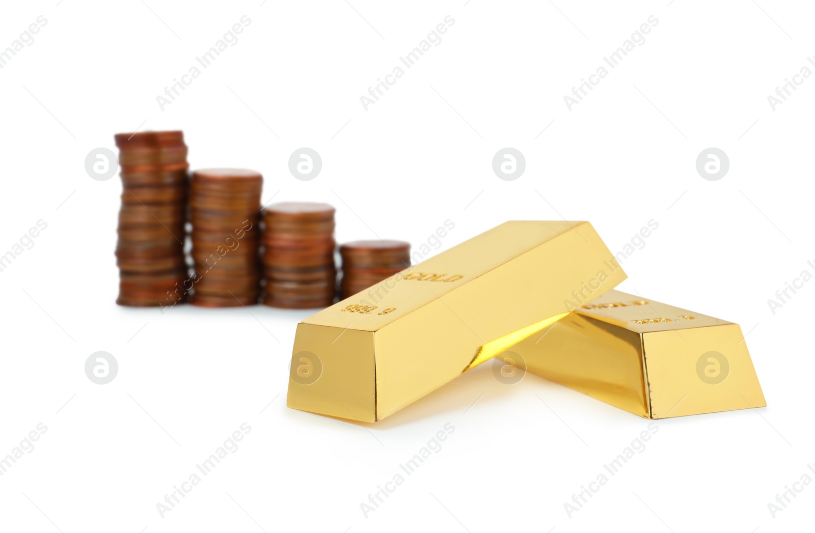 Photo of Shiny gold bars and coins on white background