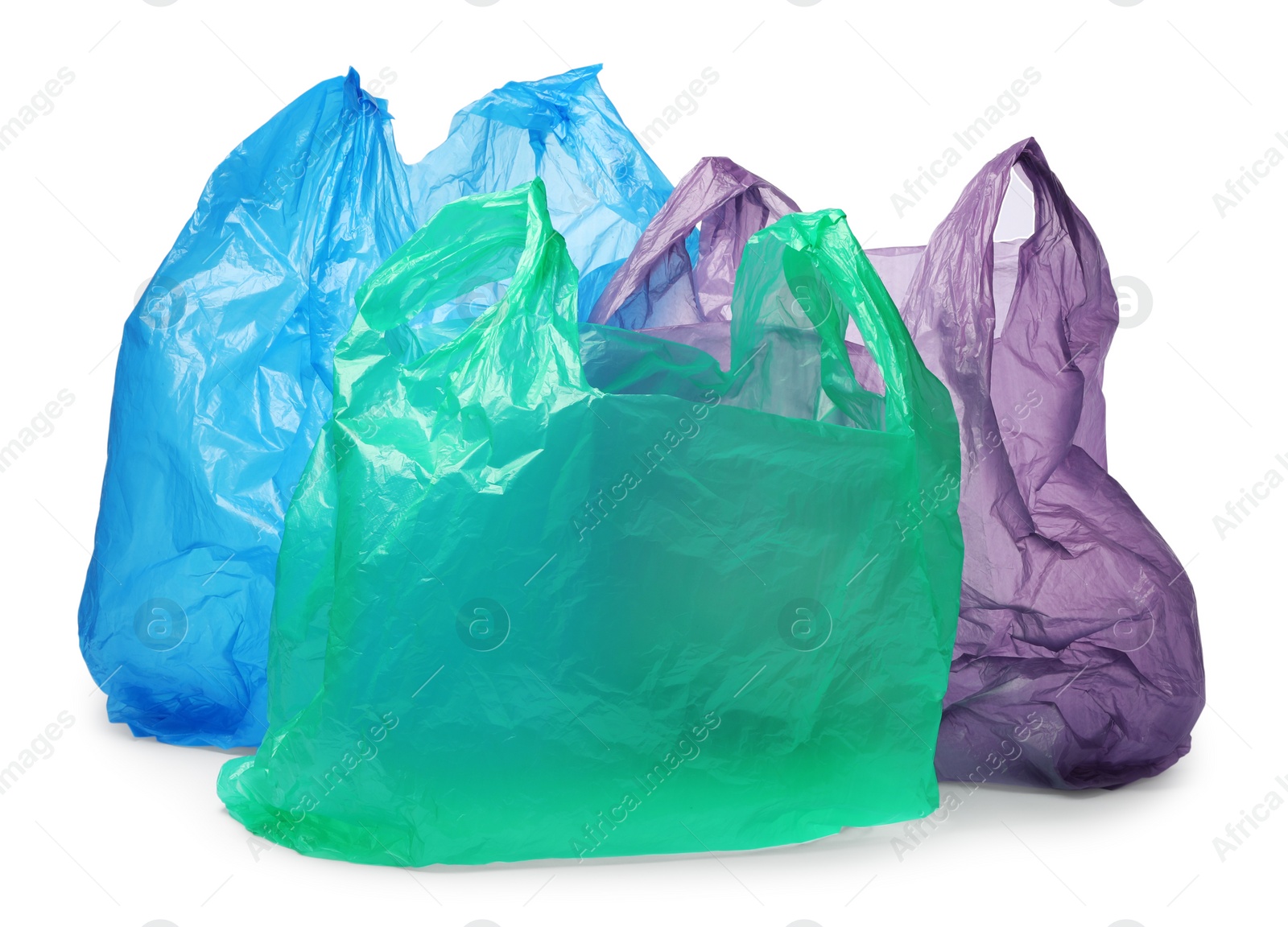 Photo of Many different plastic bags on white background