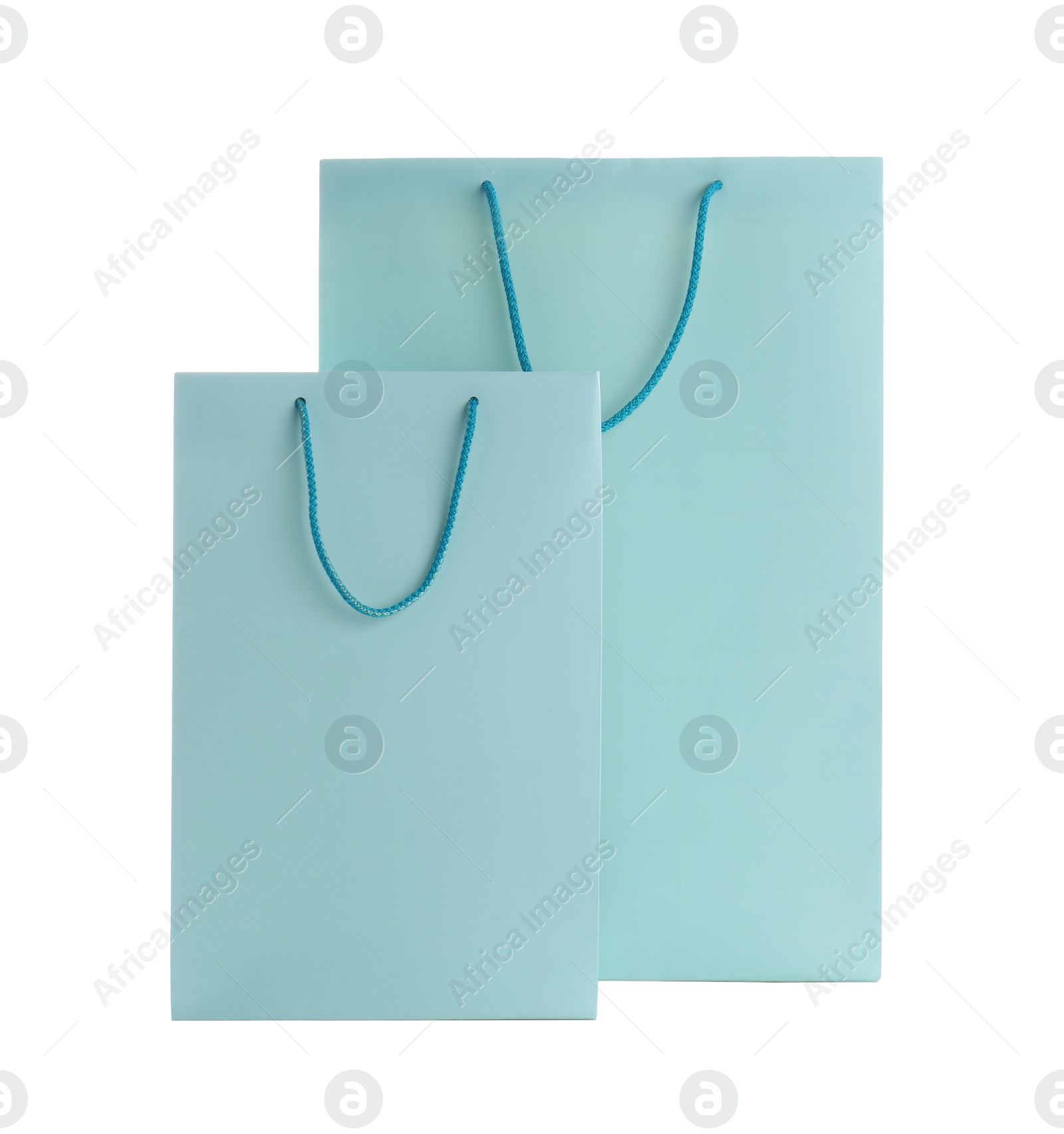 Photo of Light blue paper shopping bags isolated on white