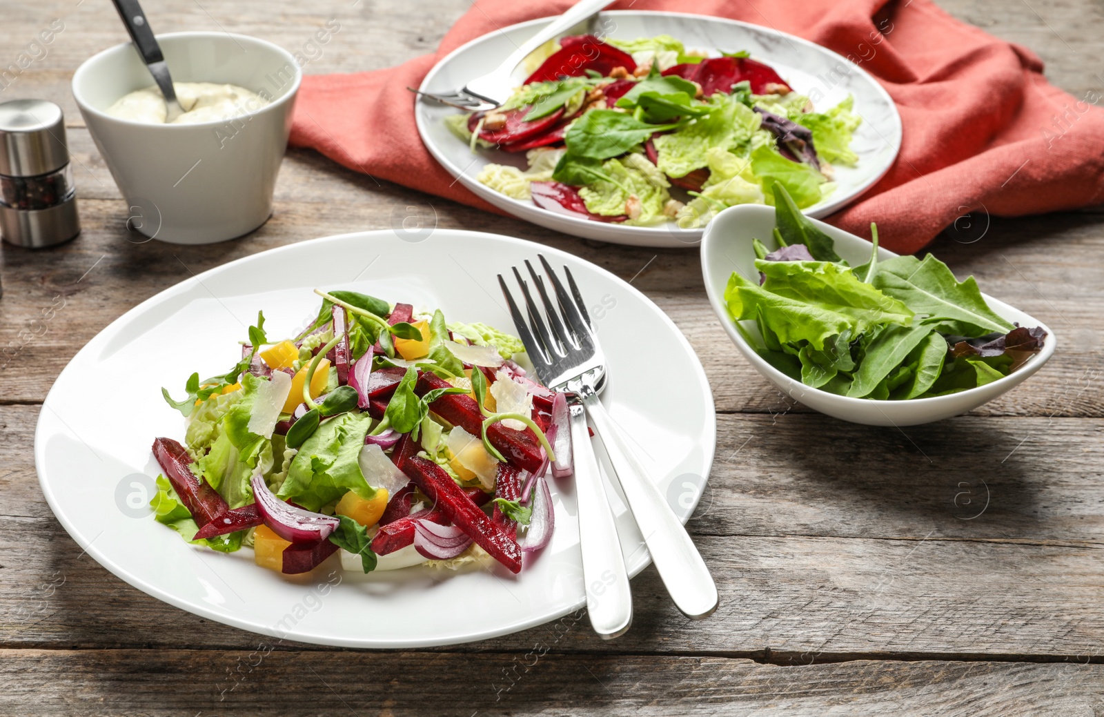 Photo of Plate with delicious beet salad served on table