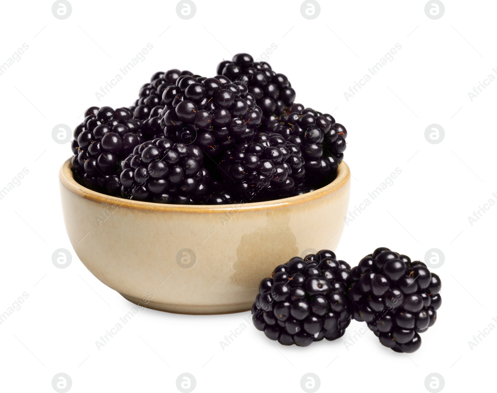 Photo of Bowl of ripe blackberries isolated on white