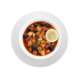 Photo of Meat solyanka soup with sausages, olives and vegetables in bowl isolated on white, top view