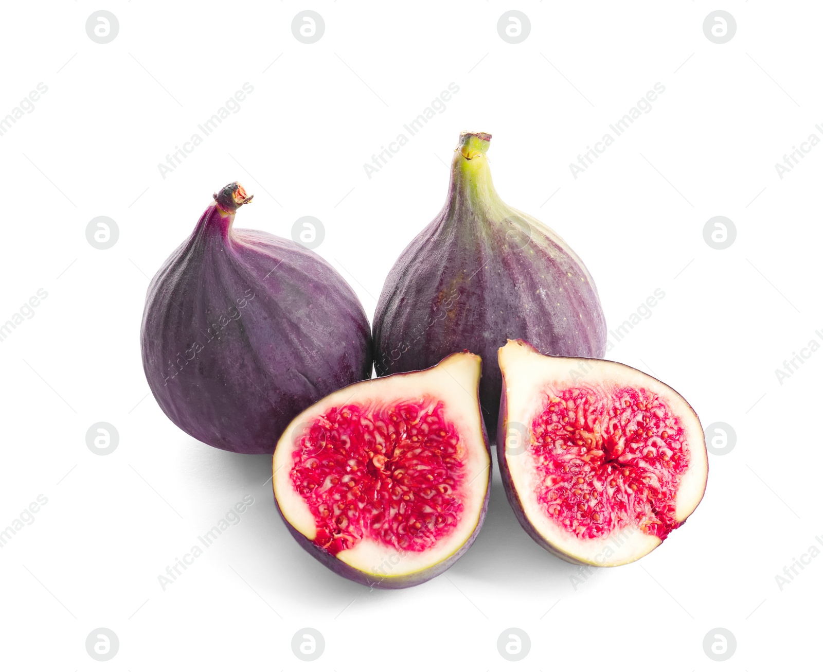 Photo of Whole and cut purple figs on white background