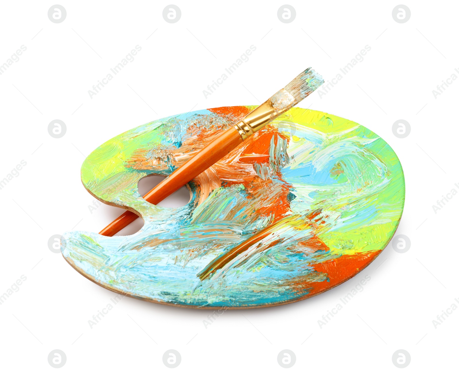 Photo of Artist's palette with mixed paints and brush isolated on white