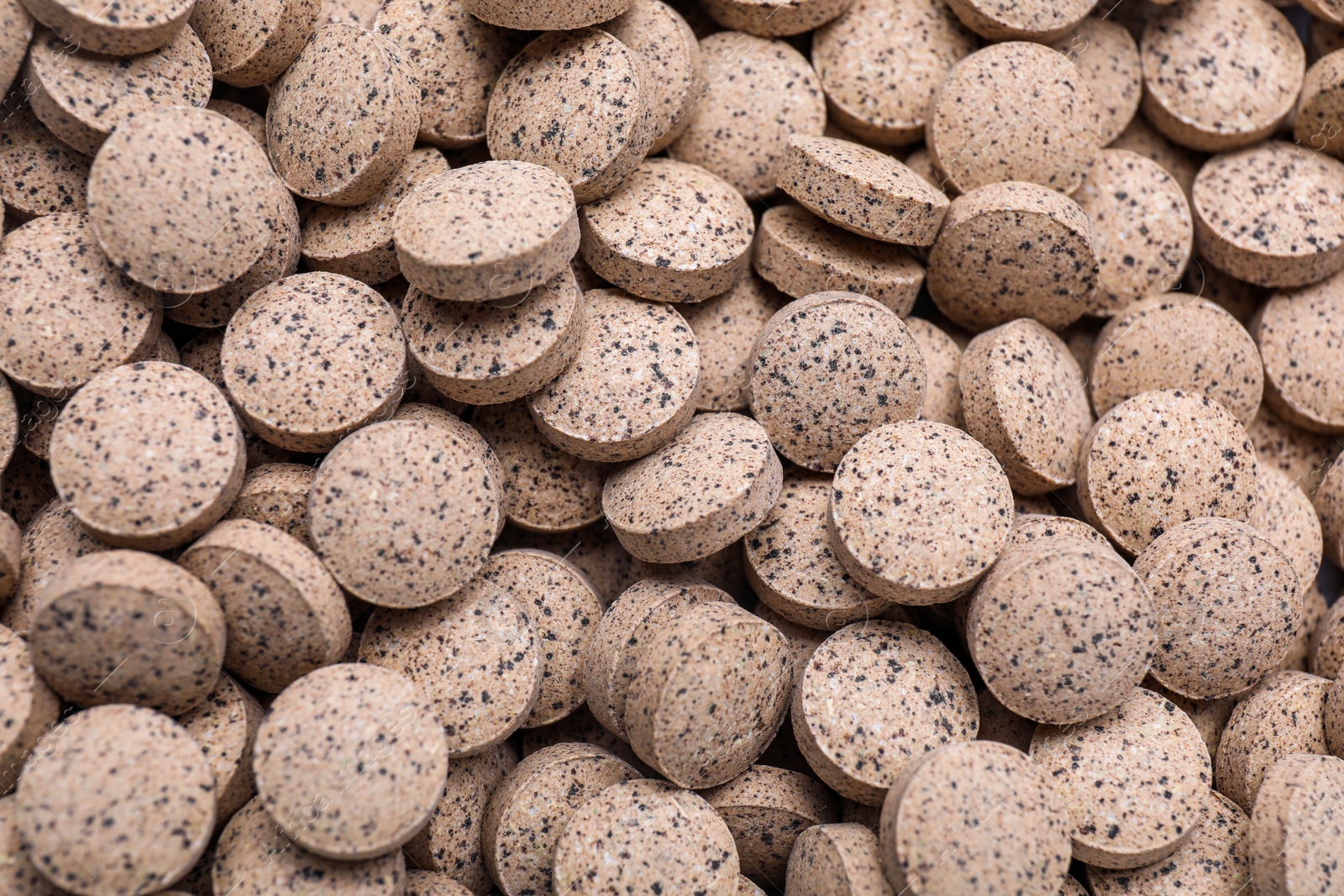 Photo of Brewer`s yeast tablets as background, closeup view