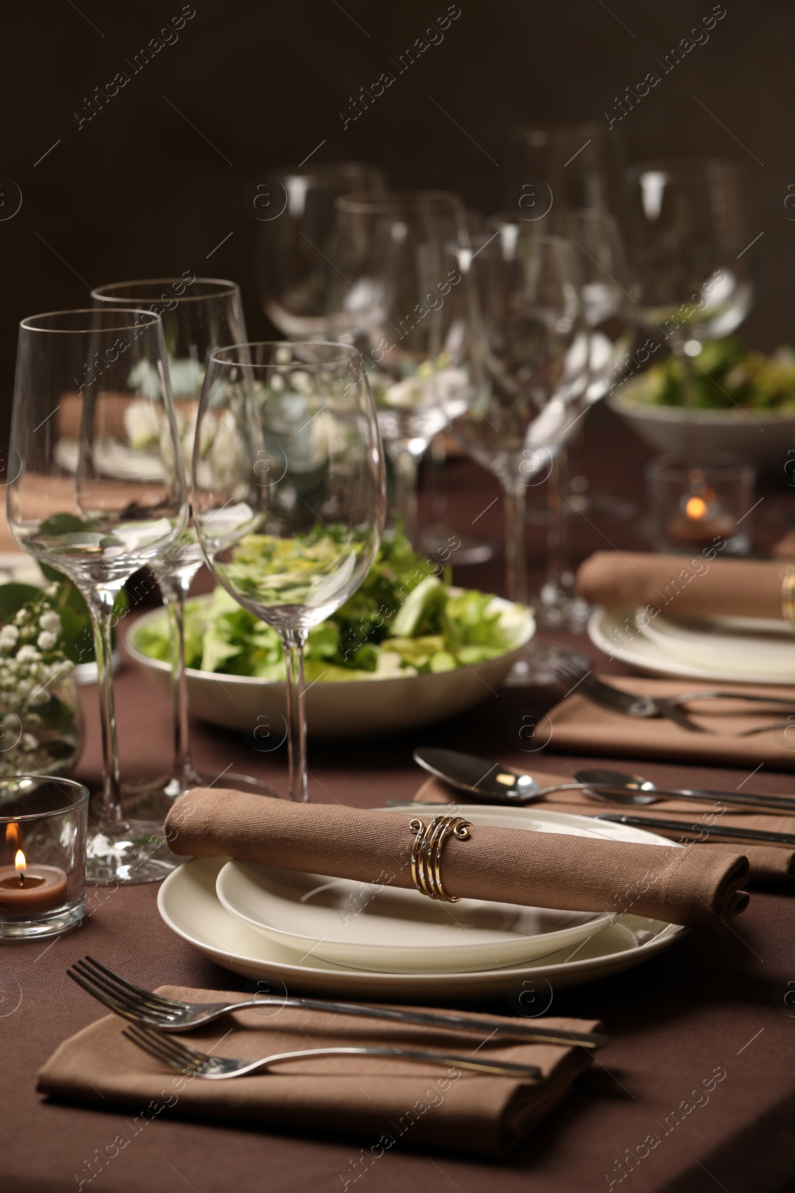 Photo of Stylish elegant table setting for festive dinner in restaurant