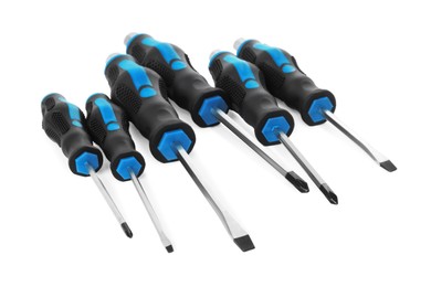 Photo of Set of screwdrivers with blue handles isolated on white