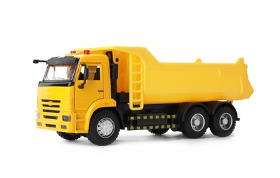Photo of Yellow toy tipper truck isolated on white