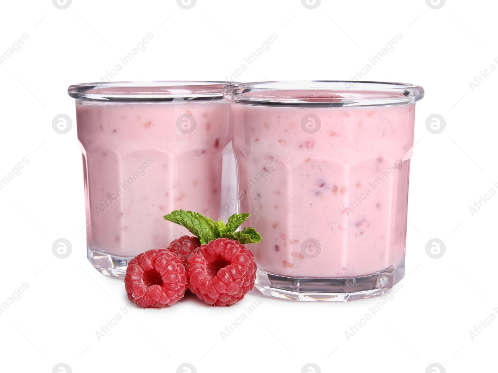 Photo of Tasty fresh raspberry smoothie in glasses on white background