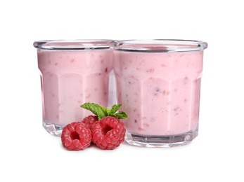 Photo of Tasty fresh raspberry smoothie in glasses on white background