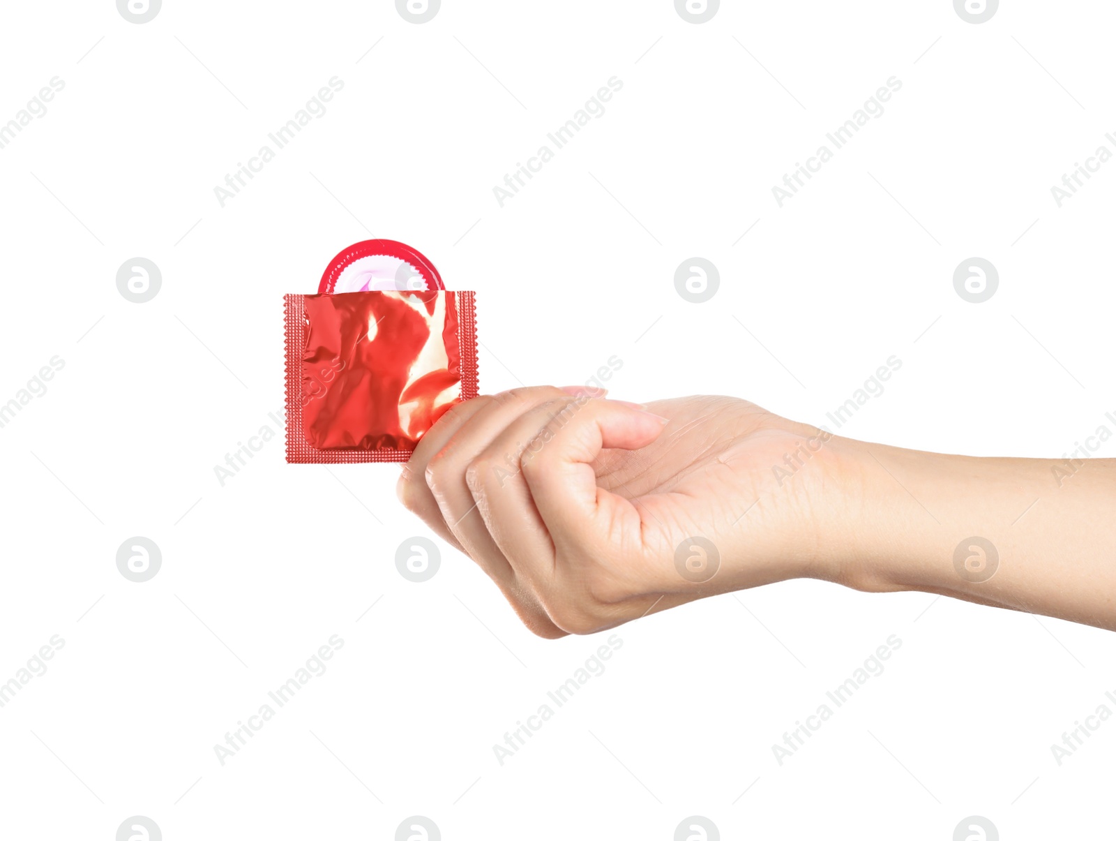 Photo of Woman holding condom in wrapper on white background, closeup
