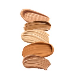 Image of Different shades of liquid skin foundation on white background, top view