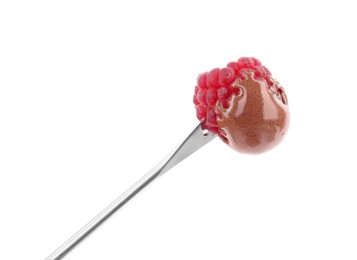 Photo of Raspberry with melted chocolate isolated on fondue fork against white background