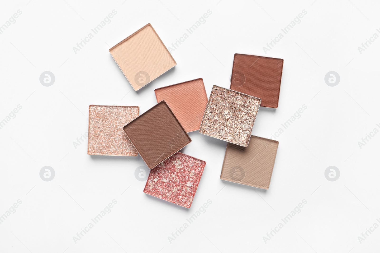 Photo of Different beautiful eye shadows on white background, flat lay