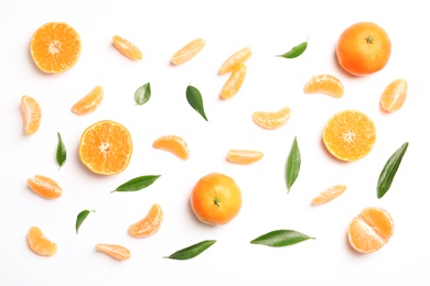 Photo of Composition with tangerines and leaves on white background, top view