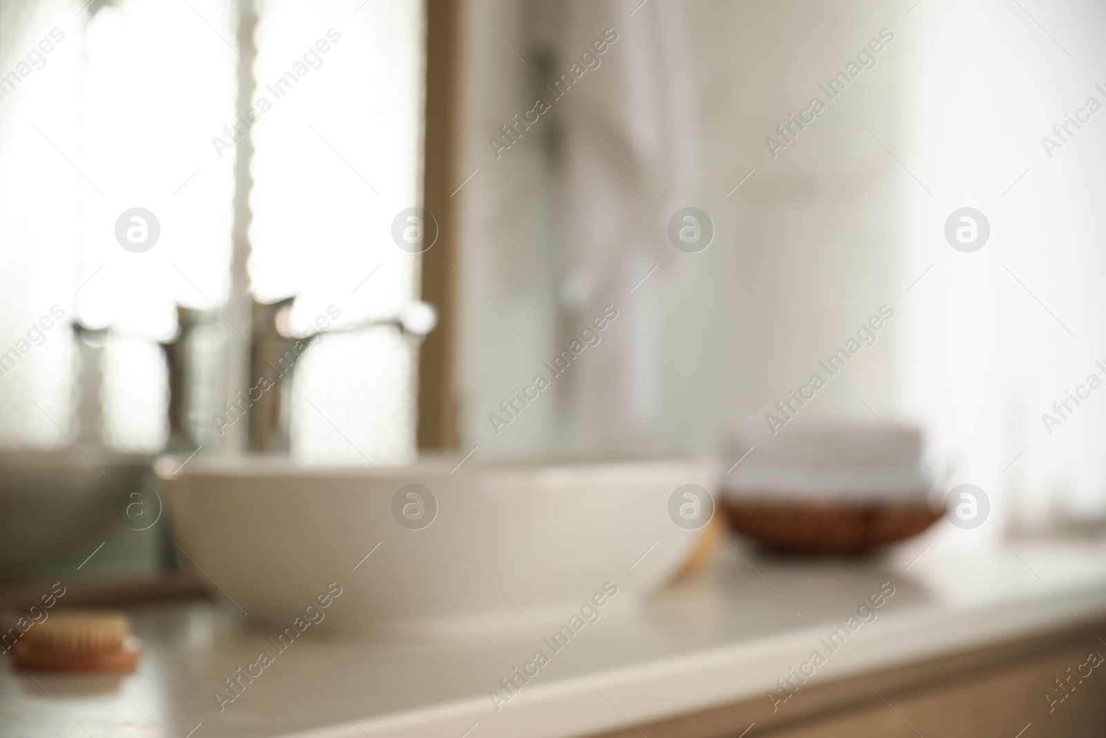 Photo of Blurred view of light modern bathroom interior