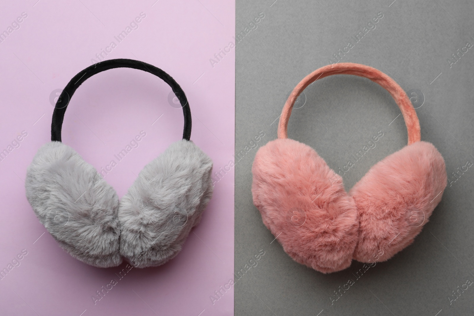 Photo of Stylish winter earmuffs on color background, flat lay