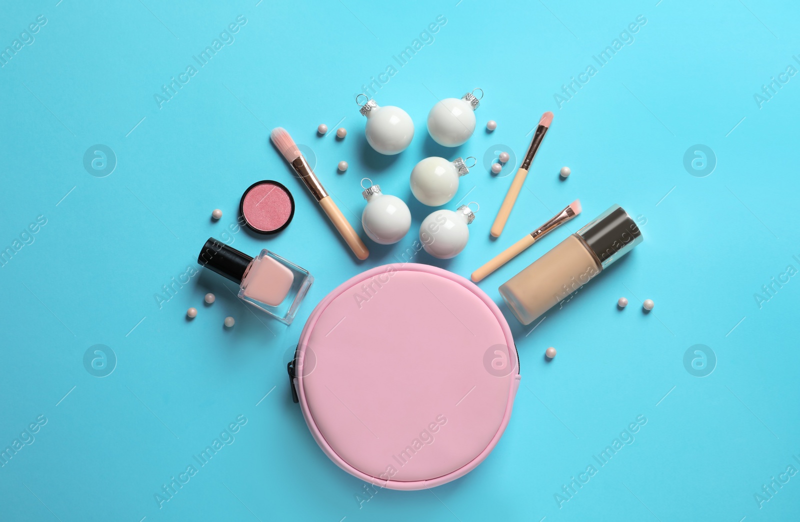 Photo of Flat lay composition with makeup products and Christmas decor on color background