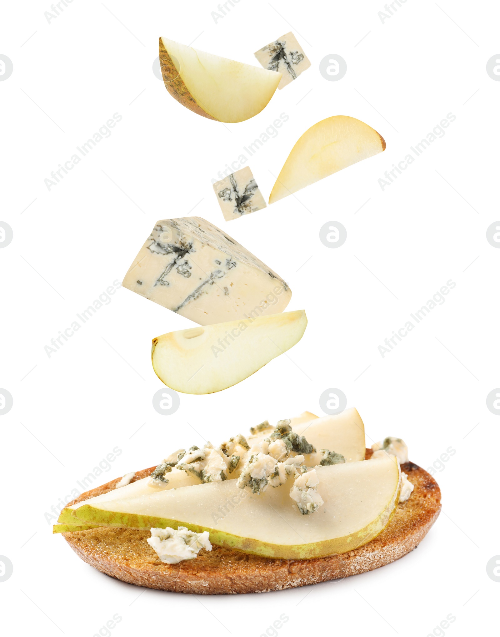Tasty bruschetta with flying ingredients on white background Image of Tasty bruschetta with flying ingredients on white background