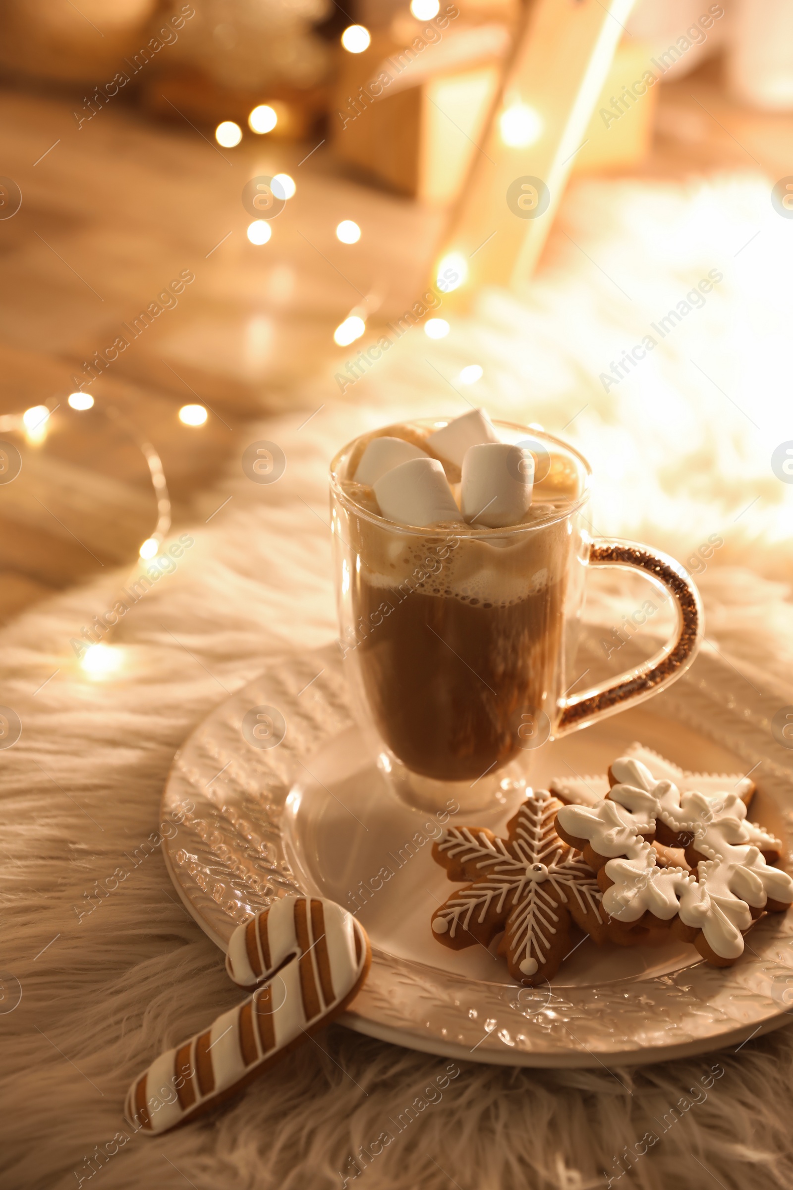 Photo of Cup of hot drink with marshmallows and cookies on plate. Christmas atmosphere