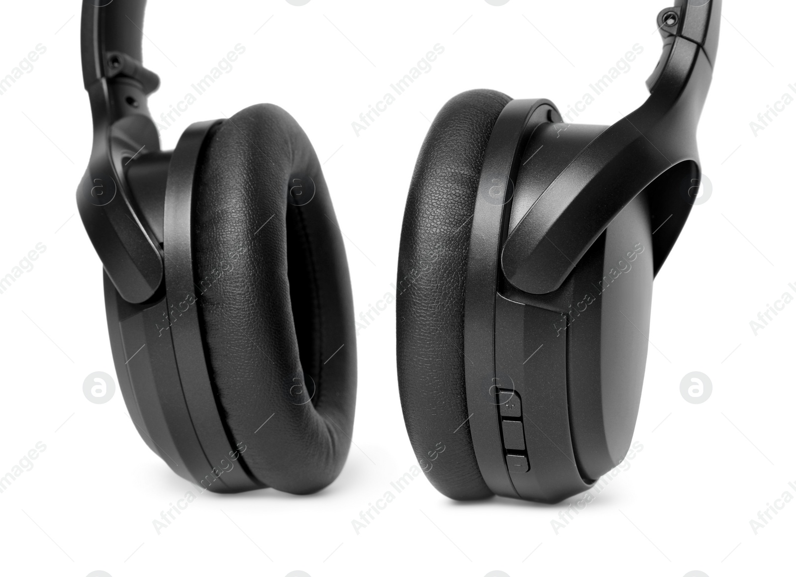 Photo of Modern black wireless headphones isolated on white