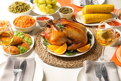 Delicious roasted turkey with garnish on dinner table