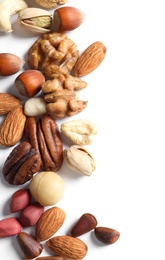 Photo of Mixed organic nuts on white background, top view. Space for text