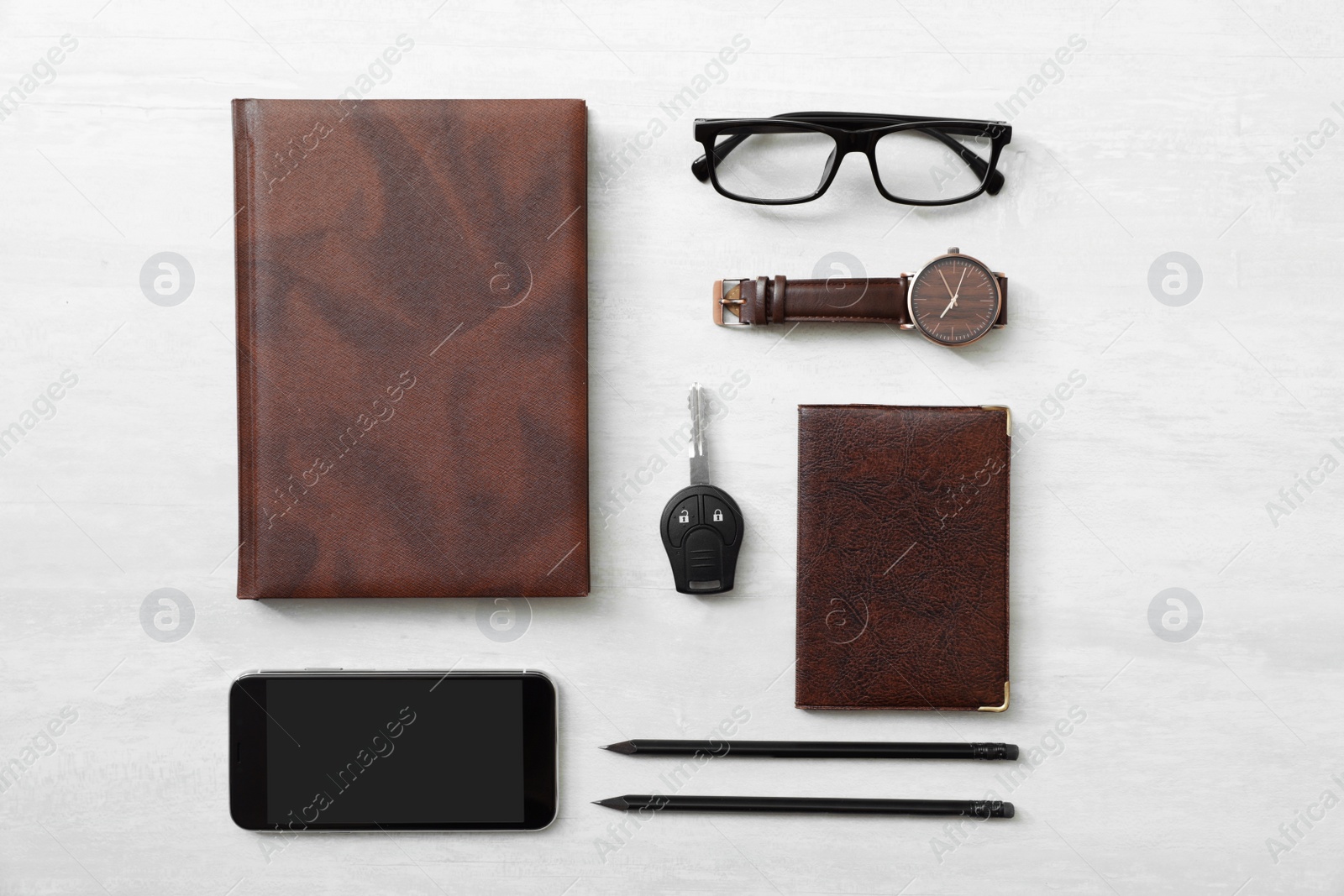 Photo of Flat lay composition with male accessories and car key on light background. Space for text