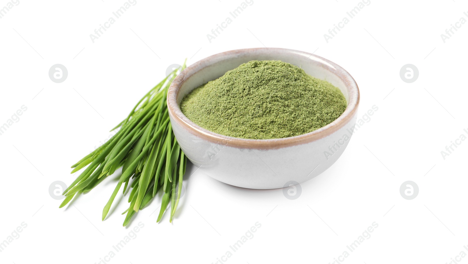 Photo of Wheat grass powder in bowl and fresh sprouts isolated on white
