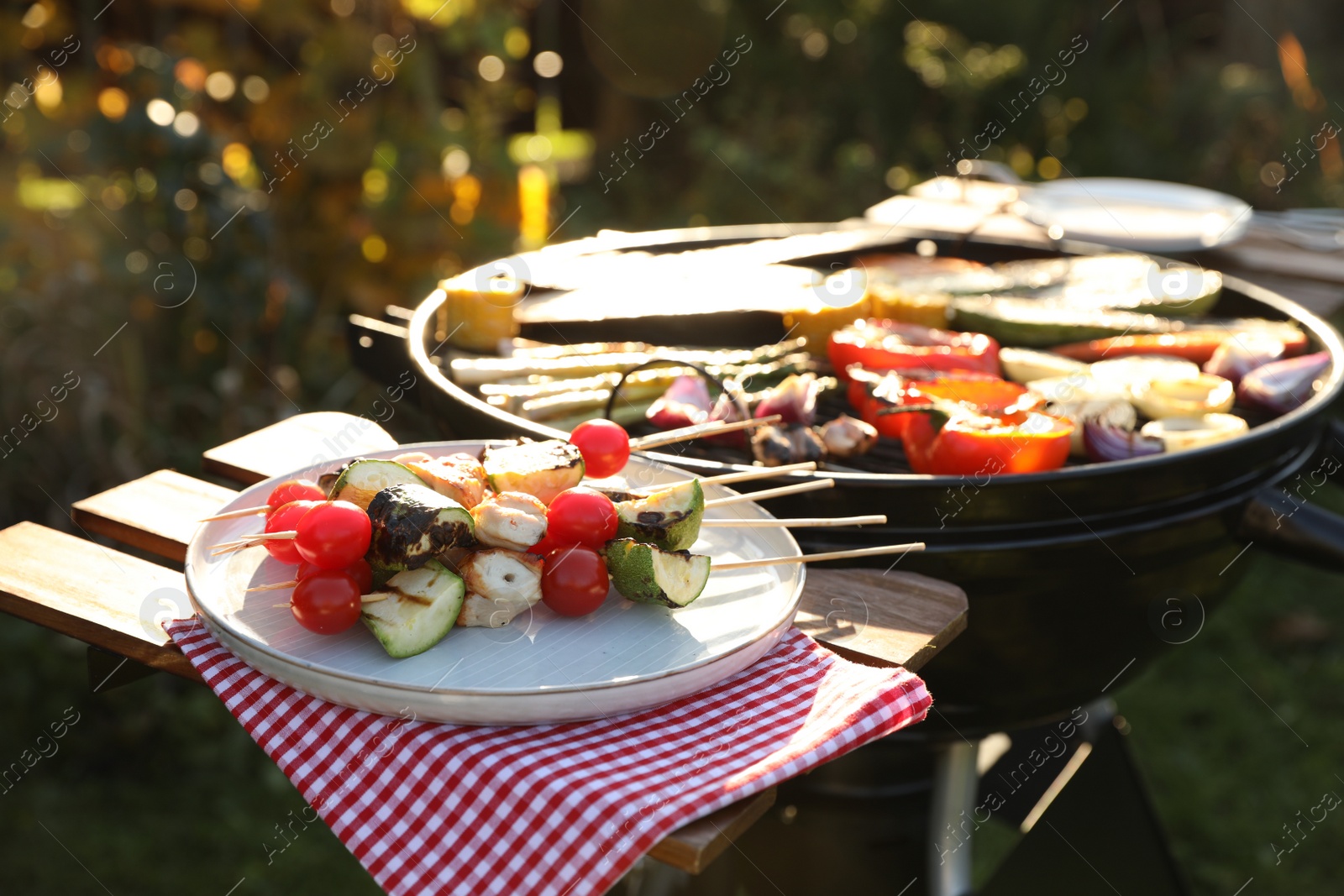 Photo of Cooked food products and grill barbecue outdoors