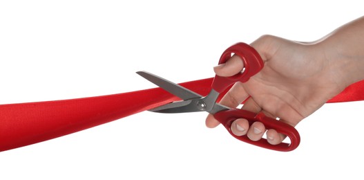 Photo of Woman cutting red ribbon on white background, closeup