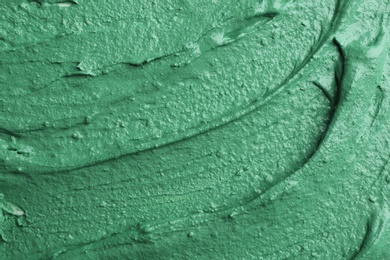 Photo of Natural spirulina facial mask as background, closeup