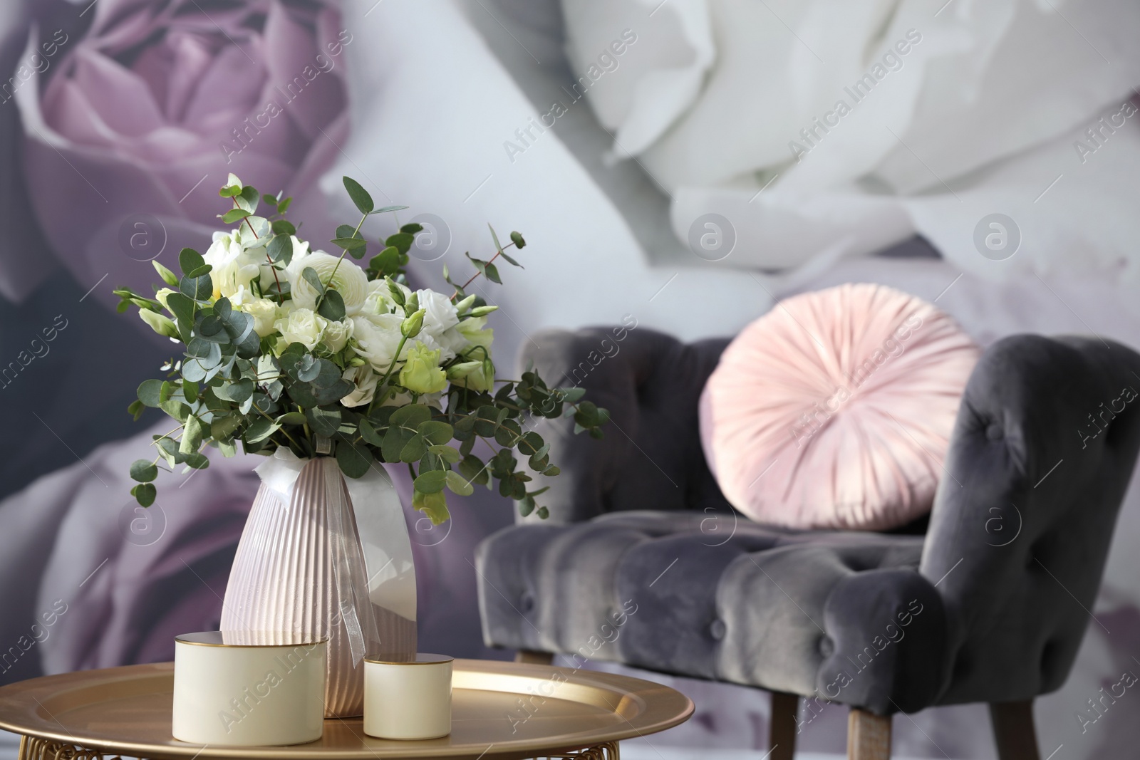 Photo of Beautiful bouquet of flowers on table in room. Stylish interior design