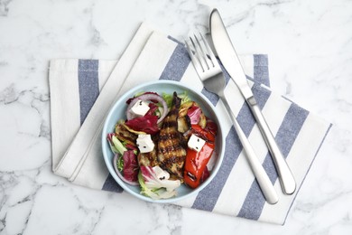 Photo of Delicious salad with roasted eggplant, feta cheese and chia seeds served on white marble table, flat lay