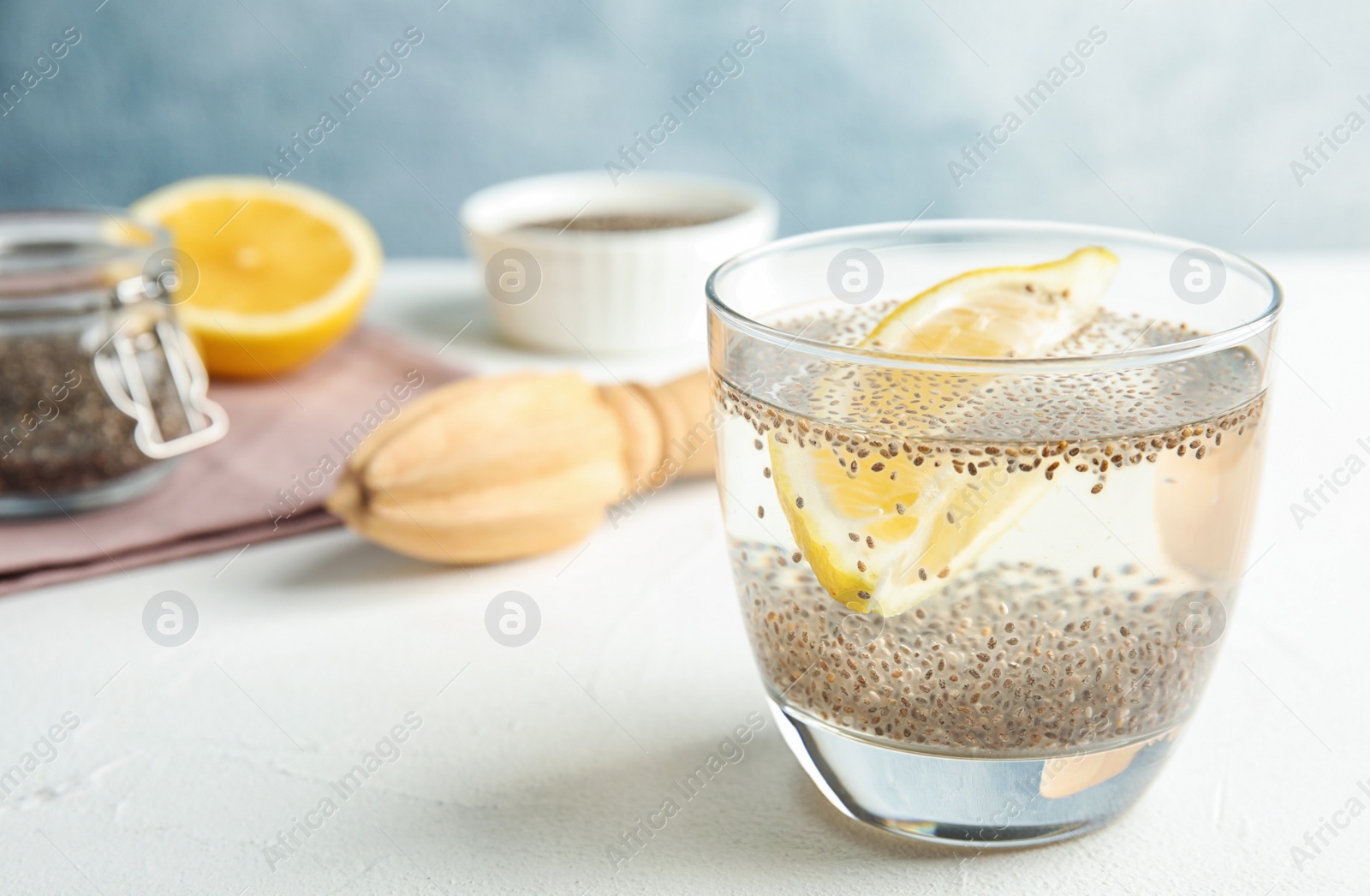 Photo of Composition with glass of water and chia seeds on table. Space for text