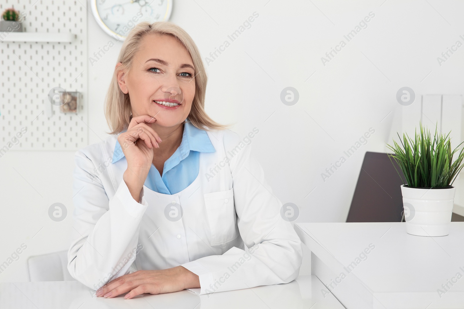 Photo of Senior female receptionist working in hospital