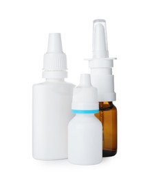 Photo of Many different nasal sprays on white background