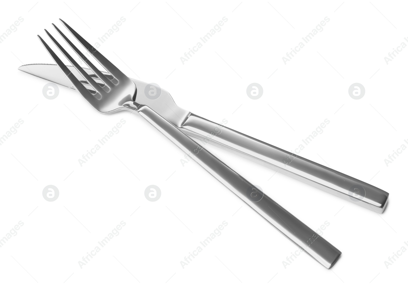 Photo of New shiny knife and fork isolated on white