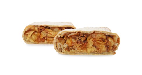 Delicious cut strudel with apples, nuts and raisins isolated on white