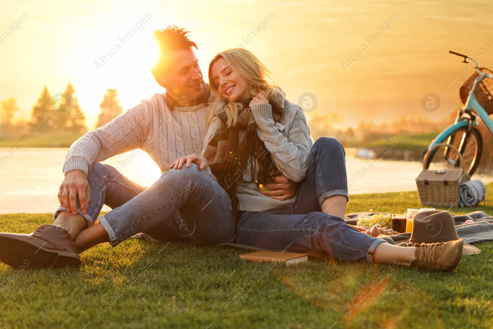 Photo of Happy young couple spending time together on picnic outdoors