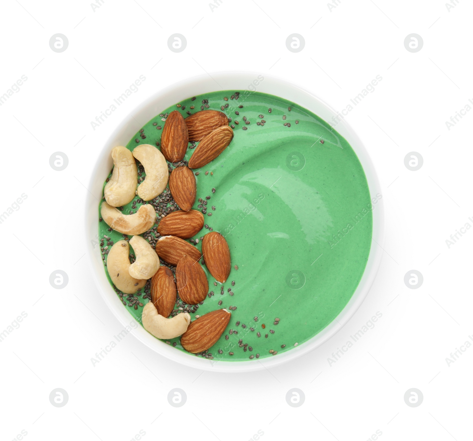 Photo of Bowl of spirulina smoothie isolated on white with nuts and chia seeds, top view