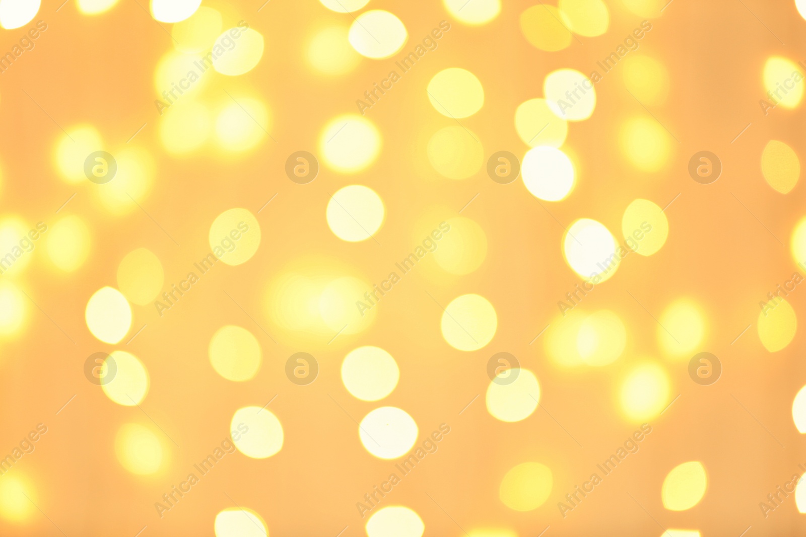 Photo of Beautiful golden lights as background. Bokeh effect