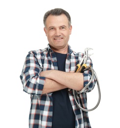 Mature plumber with hose and adjustable wrench on white background